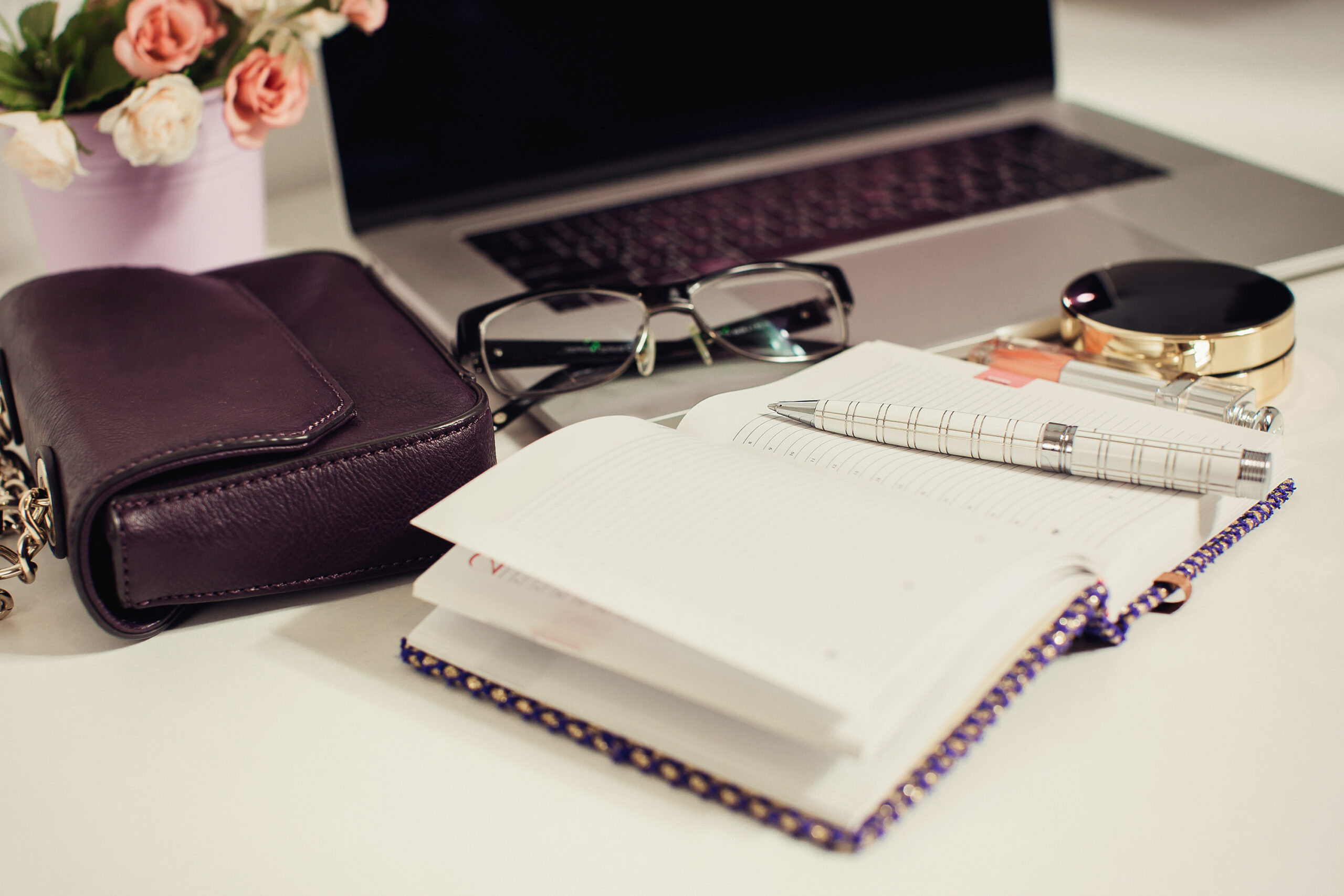Close-up of a notebook and pen on a desk, representing writing a Letter of Wishes as part of estate planning